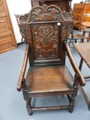 AN 18th.C.OAK WAINSCOT CHAIR WITH CARVED PANEL BACK.