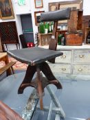 AN UNUSUAL ARTS AND CRAFTS OAK SWIVEL OFFICE OR WORK STOOL.