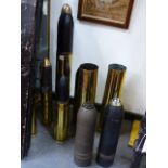 THREE LARGE HEAVY ARTILLERY SHELLS, ONE CASING WITH ENGRAVED TRENCH ART DECORATION TOGETHER WITH