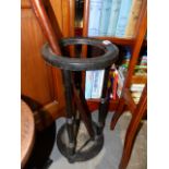 A LATE VICTORIAN EBONISED STICKSTAND TOGETHER WITH AN IVORY TOPPED WALKING STICK AND A THUMBSTICK.
