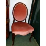 A PAIR OF CARVED MAHOGANY SALON CHAIRS IN THE FRENCH HEPPLEWHITE TASTE WITH OVAL BACKS ABOVE