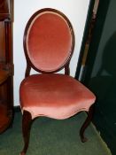 A PAIR OF CARVED MAHOGANY SALON CHAIRS IN THE FRENCH HEPPLEWHITE TASTE WITH OVAL BACKS ABOVE