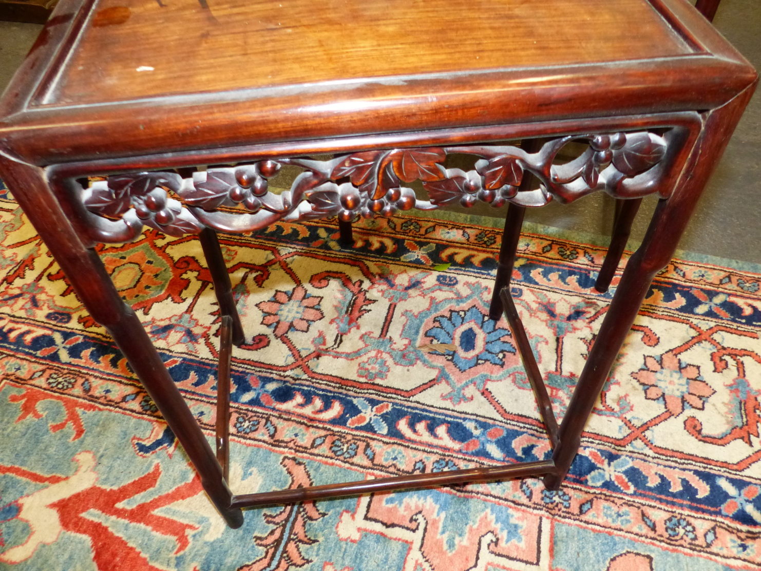 A NEST OF FOUR CHINESE CARVED HARDWOOD TABLES WITH PIERCED FOLIATE APRONS. - Image 17 of 19