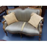 A FRENCH GILT SHOW FRAME SALON SETTEE ON CABRIOLE LEGS. W.133cms.