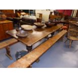 A LARGE 19\th.C.OAK REFECTORY TABLE ON CARVED BALUSTER SUPPORTS. L.227 x W.79.5cms.