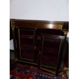A 19th.C.EBONISED BOULLE AND BRASS INLAID GLAZED SIDE CABINET. 122x45cms.