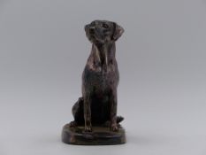 A SEATED FIGURE OF A GOLDEN RETRIVER HALLMARKED SILVER DATED 2001, SHEFFIELD.(FILLED) H. (APPROX)