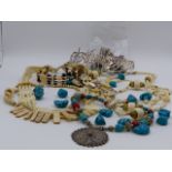 A SELECTION OF ETHNIC BEADS AND NECKLACES TO INCLUDE A WHITE METAL EASTERN CALLIGRAPHY DECORATIVE