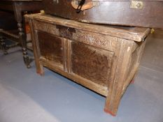 AN EARLY 18th.C.OAK PANELLED COFFER WITH CARVED FRIEZE. W.93.5cms.