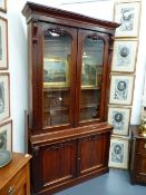 A VICTORIAN MAHOGANY GLAZED BOOKCASE. W.134 x H.246cms.