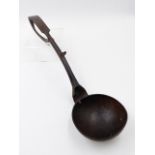 AN UNUSUAL ANTIQUE CARVED SERVING SPOON/LADLE WITH SCROLLED HANDLE DECORATED WITH A BIRD AND