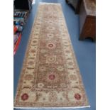 A NEAR PAIR OF ORIENTAL RUNNERS OF ZEIGLER DESIGN. 347x80 AND 350x84cms.