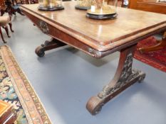 A CARVED ROSEWOOD VICTORIAN LIBRARY TABLE WITH SHAPED TRESTLE ENDS AND SCROLL DECORATION. H.72 x W.