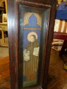 A FINE MEDIEVAL STYLE NEEDLEPOINT PANEL OF A SAINT IN MOULDED OAK FRAME BY ROWLEY TOGETHER WITH AN