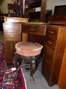 A HEAL'S STYLE AMERICAN WALNUT CORNER DESK WITH FIVE DRAWERS.