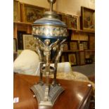 AN ORMOLU AND PATINATED FRENCH EMPIRE STYLE TRIFORM LAMP BASE WITH WINGED CARYATID SUPPORTS. OVERALL