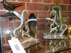 A PAIR OF ART DECO CHROMED EQUESTRIAN BOOK ENDS.DESIGNED BY FRANZ HAGENAUR H.14cms.