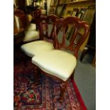A SET OF TWELVE VICTORIAN STYLE MAHOGANY SHAPED BALLOON BACK DINING CHAIRS