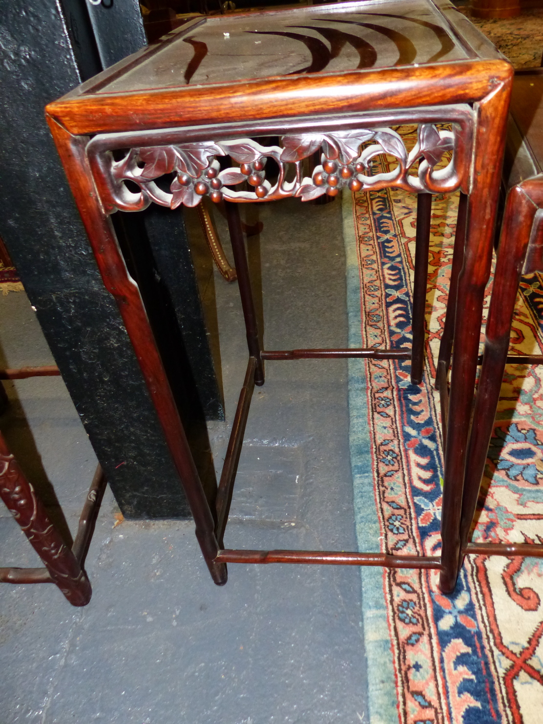 A NEST OF FOUR CHINESE CARVED HARDWOOD TABLES WITH PIERCED FOLIATE APRONS. - Image 3 of 19