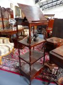 A MAHOGANY ADJUSTABLE FOUR TIER WHAT NOT STAND WITH RING TURNED SUPPORTS AND BASE DRAWER ON BRASS