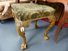 A CARVED GILTWOOD STOOL IN THE EARLY 18th.C.STYLE.