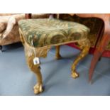 A CARVED GILTWOOD STOOL IN THE EARLY 18th.C.STYLE.