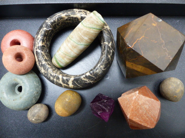 A 19th.C. WEST AFRICAN CARVED HARDSTONE BANGLE, CARVED AND POLISHED HARD STONE SAMPLES, A LARGE