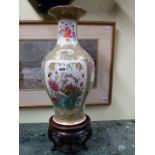 A CHINESE CANTONESE BALUSTER FORM VASE ON ASSOCIATED CARVED HARDWOOD BASE. VASE H.44cms.