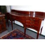 A LATE GEORGIAN MAHOGANY AND BOX INLAID SERPENTINE SIDEBOARD ON SQUARE TAPERED LEGS. W.196cms.