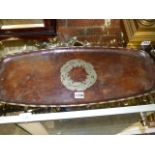 TWO HUGH WALLIS COPPER TRAYS, BOTH WITH FOLIATE FORM MEDALLIONS AND GADROONED RIMS, BOTH SIGNED.