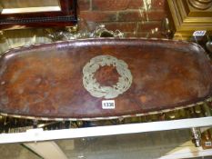 TWO HUGH WALLIS COPPER TRAYS, BOTH WITH FOLIATE FORM MEDALLIONS AND GADROONED RIMS, BOTH SIGNED.