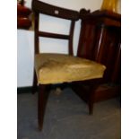 A PAIR OF CARVED MAHOGANY REGENCY SABRE LEG CHAIRS TOGETHER WITH A PAIR OF GEORGIAN SADDLE SEAT