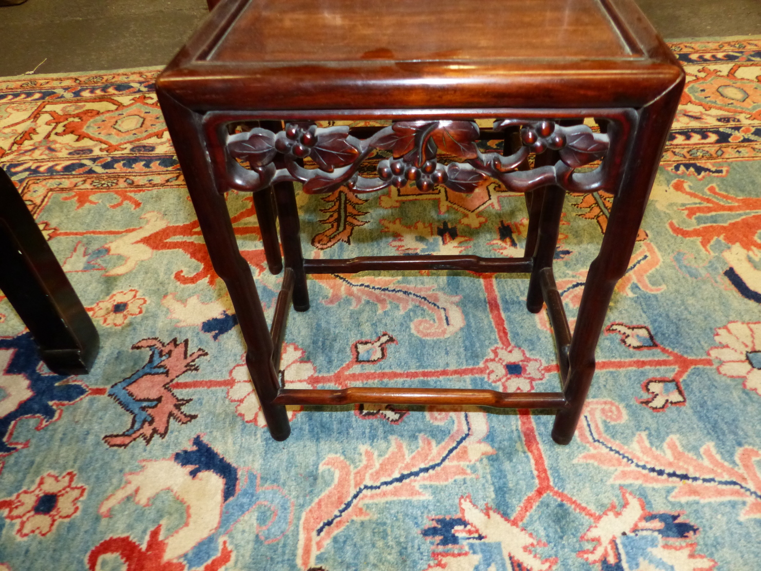 A NEST OF FOUR CHINESE CARVED HARDWOOD TABLES WITH PIERCED FOLIATE APRONS. - Image 11 of 19