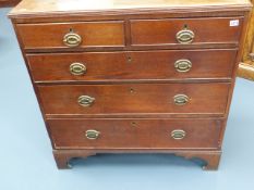 A LATE GEORGIAN OAK CHEST OF TWO SHORT AND THREE LONG DRAWERS ON BRACKET FEET. W.97 x H.99cms.