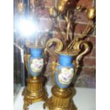 A PAIR OF ANTIQUE ORMOLU MOUNTED NEO CLASSICAL STYLE URNS WITH THREE LIGHT CANDELABRA TOPS AND