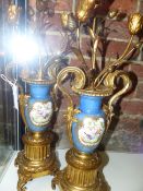 A PAIR OF ANTIQUE ORMOLU MOUNTED NEO CLASSICAL STYLE URNS WITH THREE LIGHT CANDELABRA TOPS AND