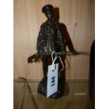 A BRONZE FIGURE OF A WWI SOLDIER CARRYING HIS RIFLE, SIGNED TO BASE GOMERT. H.22cms.