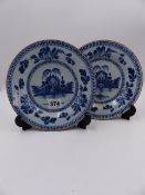 A PAIR OF ANTIQUE DELFT BLUE AND WHITE PLATES WITH ORIENTAL LANDSCAPE DECORATION. D.20cms.