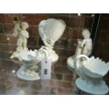 A GROUP OF FOUR ROYAL WORCESTER FIGURINES TO INCLUDE A PAIR OF DOLPHIN SUPPORTED SHELL DISHES,