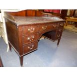 A GEORGIAN STYLE MAHOGANY KNEEHOLE DRESSING CHEST WITH GALLERY BACK TOGETHER WITH A 19th.C.