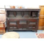 A 17th.C.AND LATER OAK COURT CUPBOARD WITH CARVED PANEL DOORS AND FRIEZE. W.182 x H.140cms. APPROX.