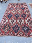 AN ANTIQUE CAUCASIAN KELIM RUG. 334x180cms.