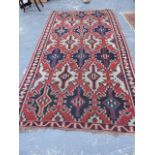 AN ANTIQUE CAUCASIAN KELIM RUG. 334x180cms.