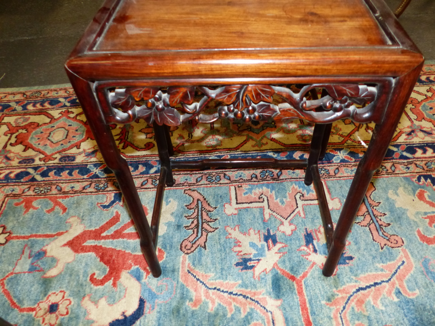 A NEST OF FOUR CHINESE CARVED HARDWOOD TABLES WITH PIERCED FOLIATE APRONS. - Image 13 of 19