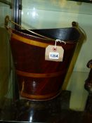 AN ANTIQUE TOLE SWING HANDLE BUCKET WITH FAUX GRAINED DECORATION.