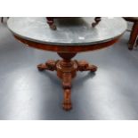 A 19th.C.MAHOGANY AND MARBLE TOPPED CENTRE TABLE ON CARVED LEGS WITH CLAW AND BALL FEET. D.98cms.