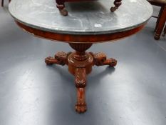 A 19th.C.MAHOGANY AND MARBLE TOPPED CENTRE TABLE ON CARVED LEGS WITH CLAW AND BALL FEET. D.98cms.