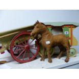 A HAND MADE MODEL GYPSY WAGON, A SIMILAR HAYCART AND A SEWN LEATHER HORSE FIGURE.