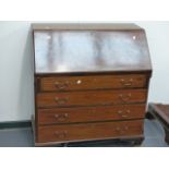 A MAHOGANY AND INLAID BUREAU.