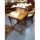 AN OAK BARLEY TWIST OCCASIONAL TABLE.